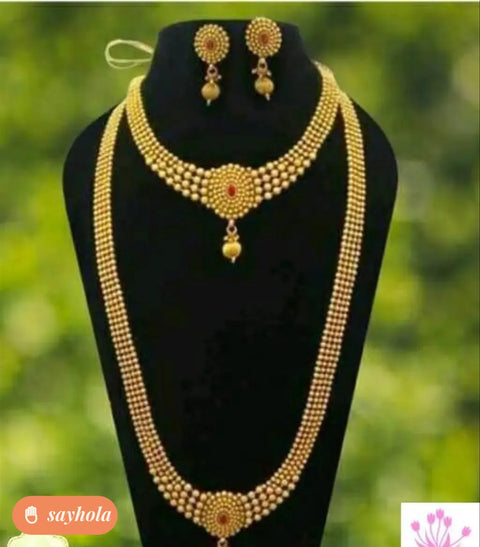 glittering pearl jewellery set with haram and earrings