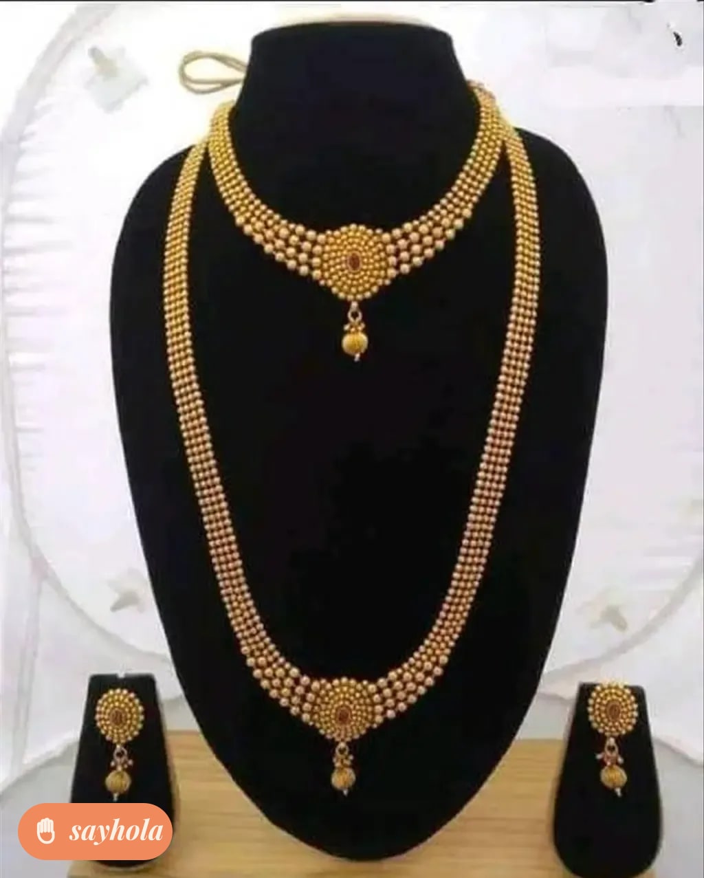 glittering pearl jewellery set with haram and earrings