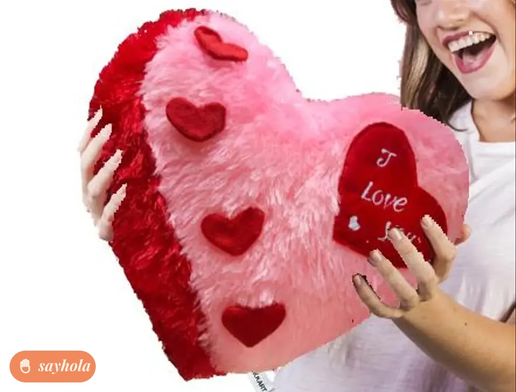 pink heart shape pillow with love message