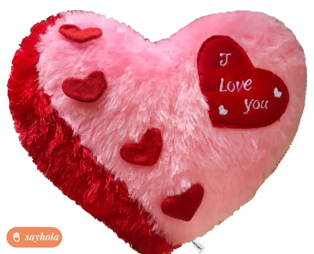 pink heart shape pillow with love message