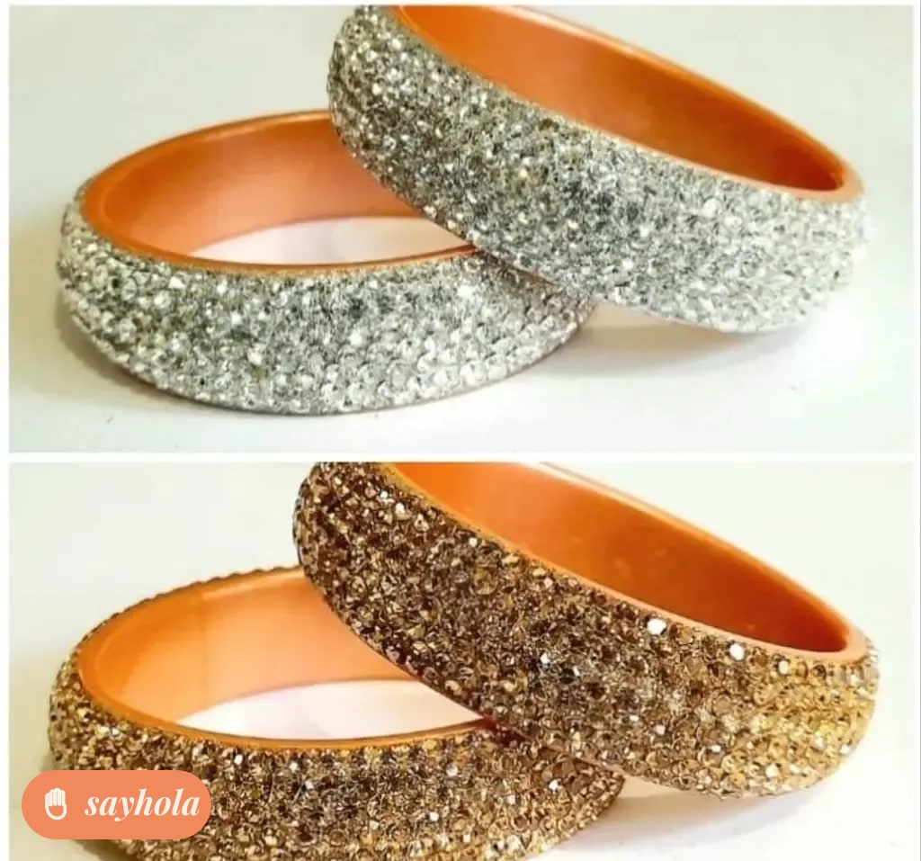 gold and silver tone bangles with cubic zirconia