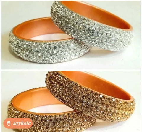 gold and silver tone bangles with cubic zirconia