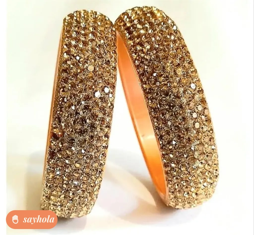 gold and silver tone bangles with cubic zirconia