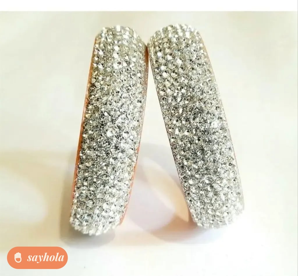 gold and silver tone bangles with cubic zirconia